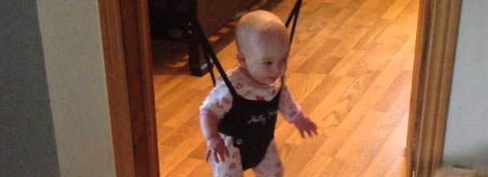 This cute dog tries to teach a baby to jump! Adorable.