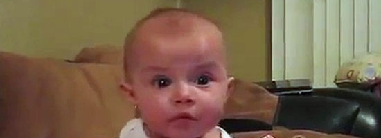 Baby girl is scared by her daddy, and she jumps. Her reaction is so cute!