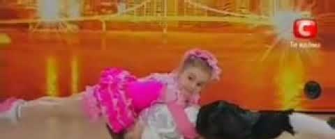 Two children dance in a talent contest and do some amazing acrobats.
