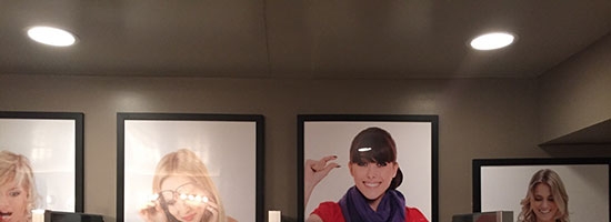 Pictures above the urinals at a bar